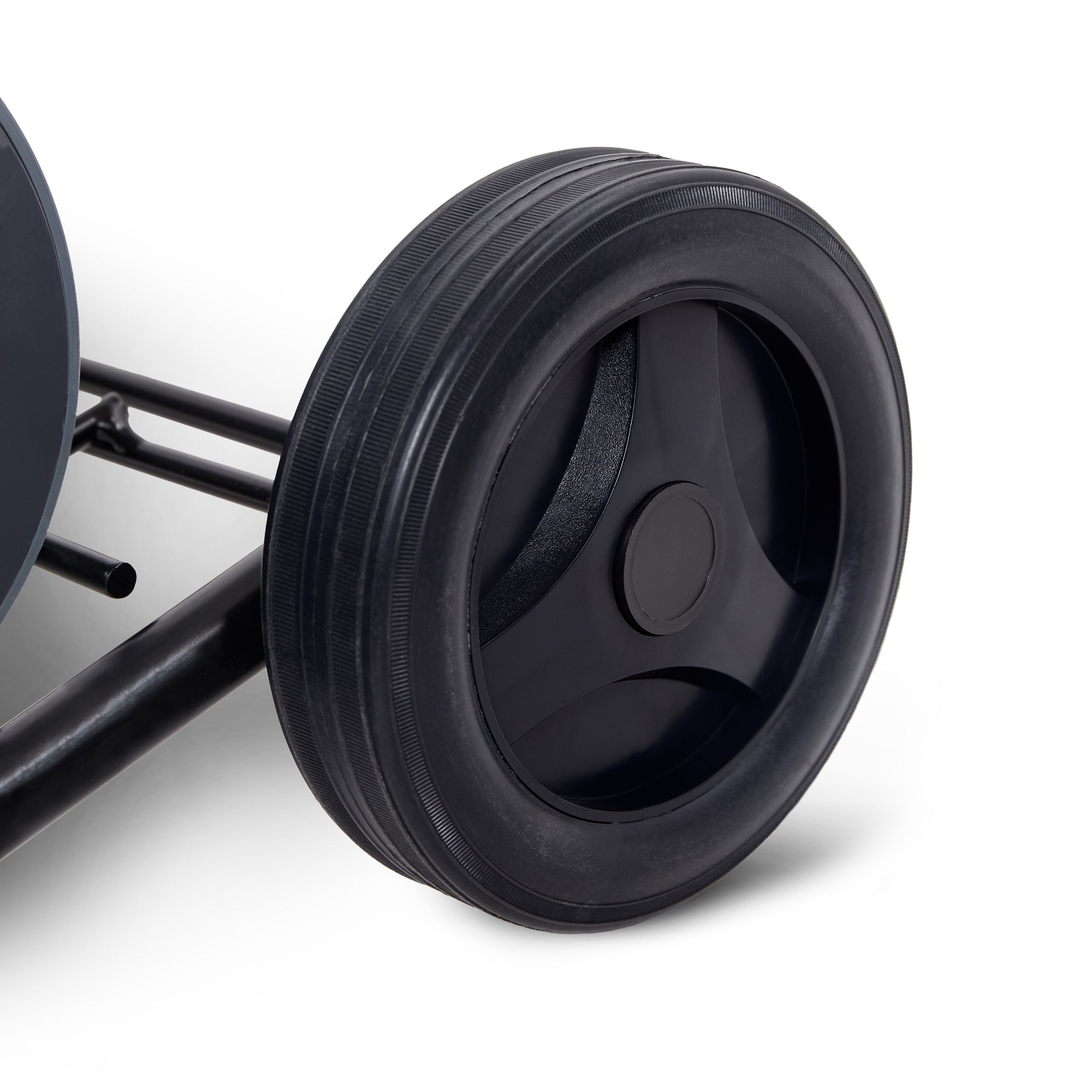 Close-up of a black wheel on a white background